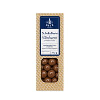 Schokolierte Himbeeren mit Vollmilchschokolade 80 g in Präsentkartonage