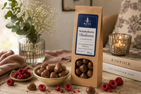 Schokolierte Himbeeren mit Vollmilchschokolade 80 g in Papiertüte